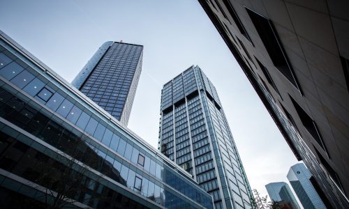 A low angle shot of high rise buildings under the clear sky in Frankfurt, Germany